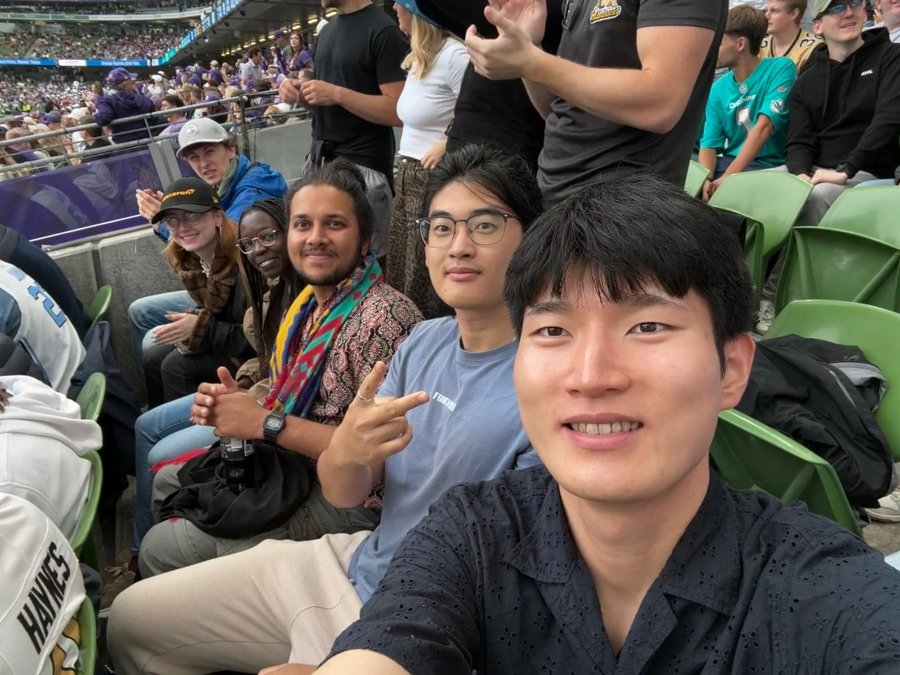 Decarb-AI group selfie in the stands at the TCU vs North Carolina game